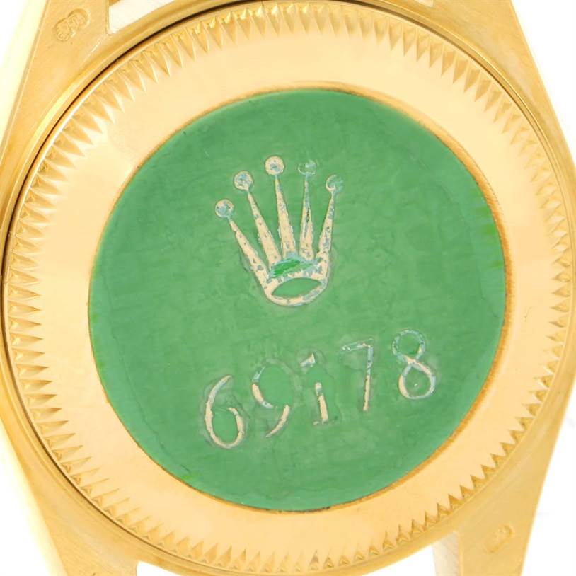 This image shows the case back of a Rolex President 69178 Women's Yellow Gold Blue Dial 69178 Women's Yellow Gold Blue Dial model, highlighting the green sticker and the model number 69178.