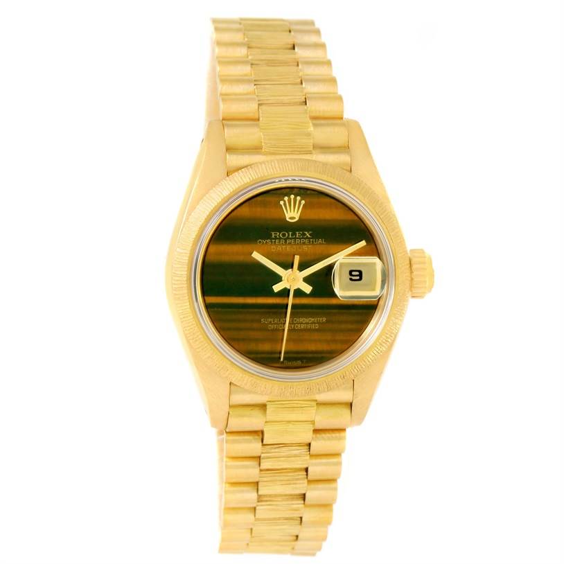 The image shows a Rolex President 69278 Women's Yellow Gold Brown Dial 69278 Women's Yellow Gold Brown Dial model watch from a front angle, highlighting its dial, bracelet, and date magnifier.
