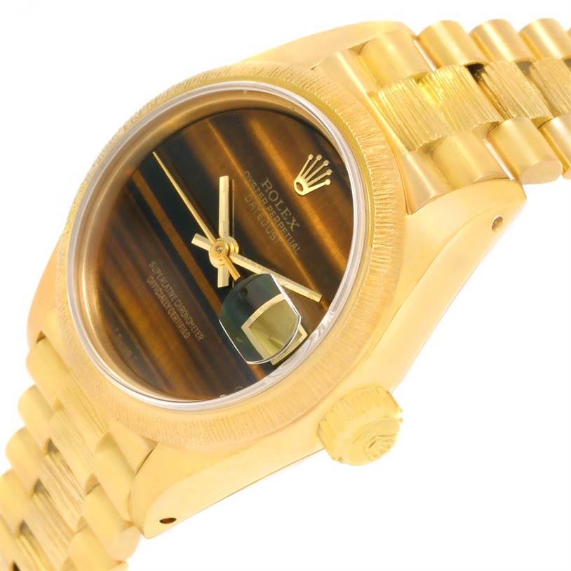 The image shows a close-up of the Rolex President 69278 Women's Yellow Gold Brown Dial 69278 Women's Yellow Gold Brown Dial model watch at an angle displaying its face, crown, and bracelet.