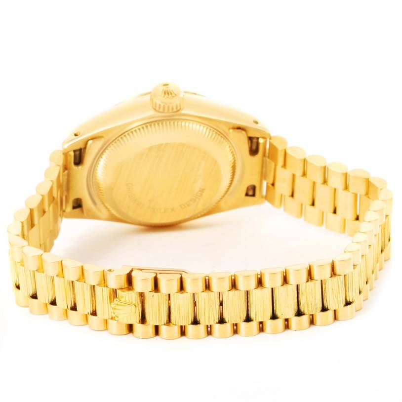 This image shows the back case and bracelet of a gold Rolex President 69278 Women's Yellow Gold Brown Dial 69278 Women's Yellow Gold Brown Dial model watch.