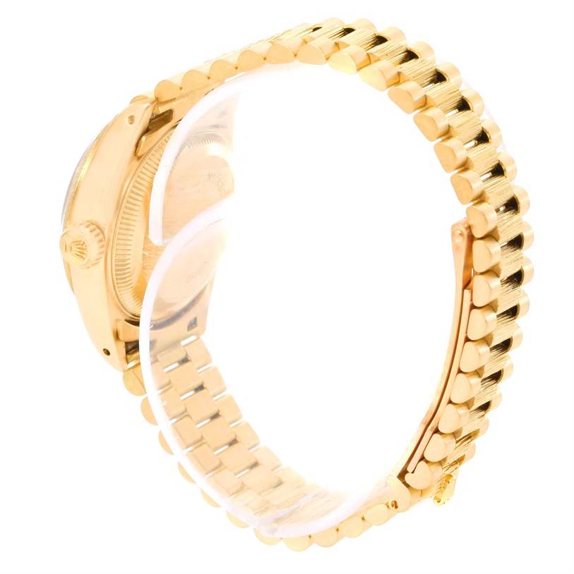 This image shows the side and back view of the Rolex President 69278 Women's Yellow Gold Brown Dial 69278 Women's Yellow Gold Brown Dial model watch, highlighting its gold bracelet and crown.