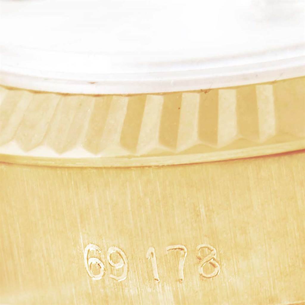 This image shows a close-up of the gold fluted bezel and the case with model number 69178 of a Rolex President 69178 Women's Yellow Gold Beige Dial 69178 Women's Yellow Gold Beige Dial watch.