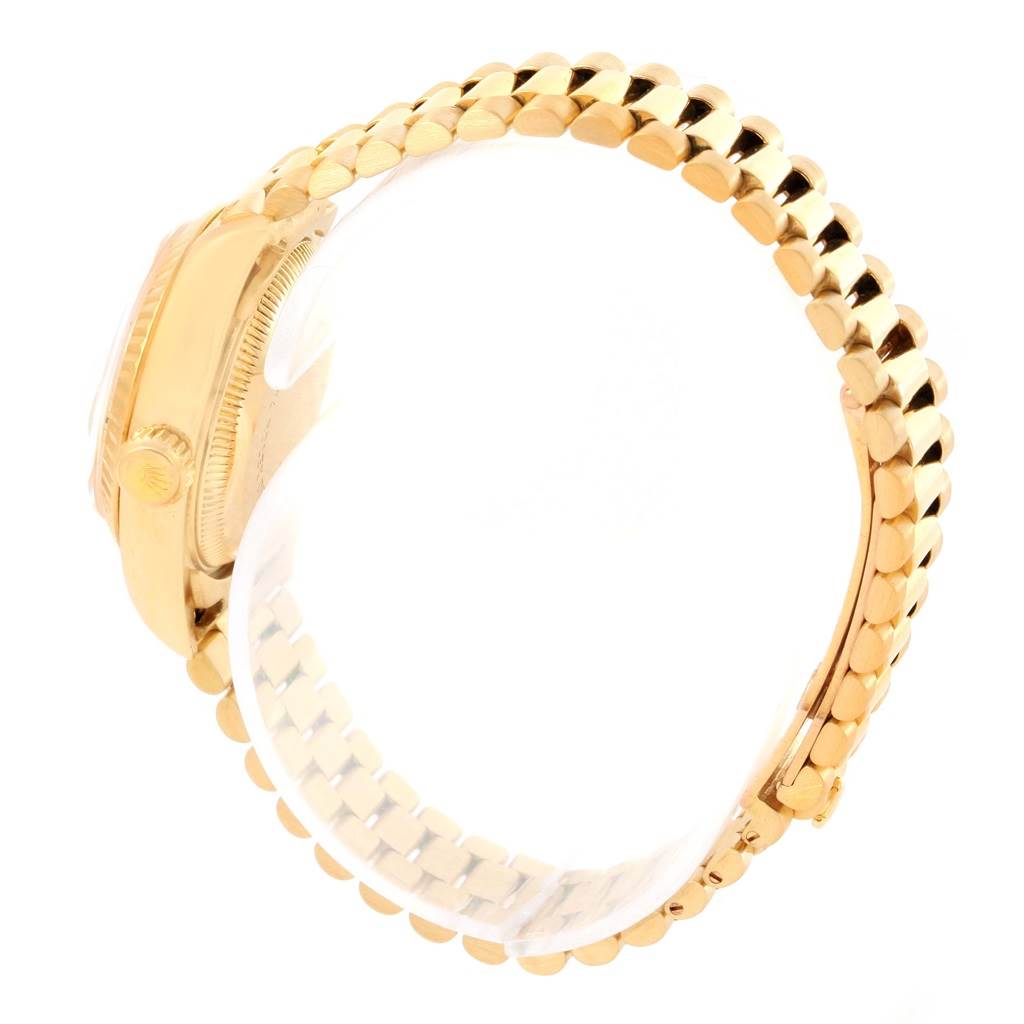 The image shows a side view of a Rolex President 69178 Women's Yellow Gold Beige Dial 69178 Women's Yellow Gold Beige Dial model watch, highlighting its gold case and bracelet.