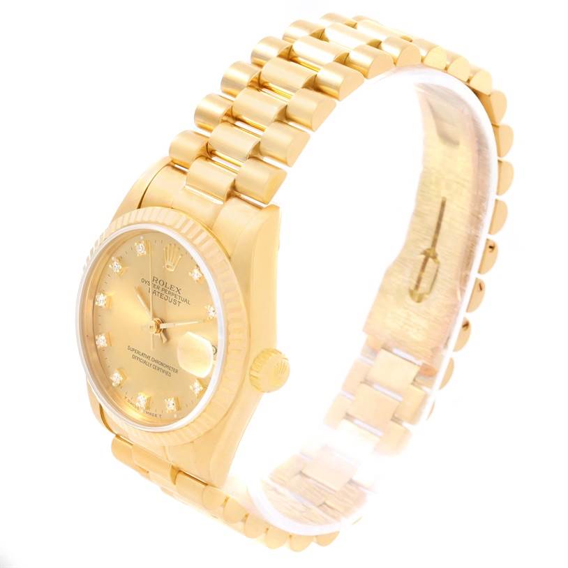 The Rolex President 68278 Women's Yellow Gold Champagne Dial 68278 Women's Yellow Gold Champagne Dial model watch is shown at a slight angle, highlighting the gold bracelet, bezel, and dial with diamond hour markers.