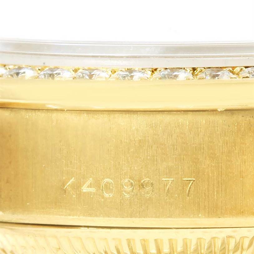 The image shows a close-up of the serial number engraving and diamond bezel of the Rolex President 79178 Women's Yellow Gold Silver Dial 79178 Women's Yellow Gold Silver Dial model watch.