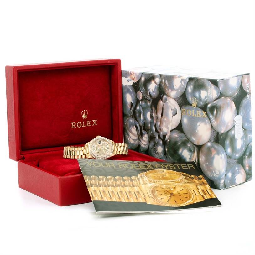 The image shows a Rolex President 79178 Women's Yellow Gold Silver Dial 79178 Women's Yellow Gold Silver Dial watch with its box, an outer case, and an informational booklet.