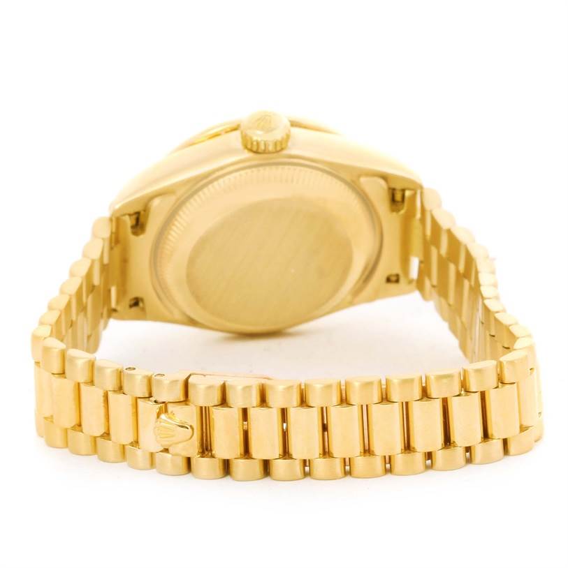 The image shows the back and bracelet of a Rolex President 79178 Women's Yellow Gold Silver Dial 79178 Women's Yellow Gold Silver Dial model watch, highlighting the case back and clasp.