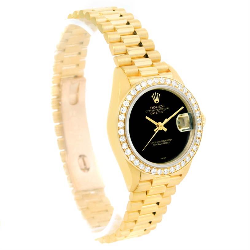 This image shows a Rolex President 69178 Women's Yellow Gold Black Dial 69178 Women's Yellow Gold Black Dial model watch from a front angle, highlighting its gold bracelet, black dial, and diamond-encrusted bezel.