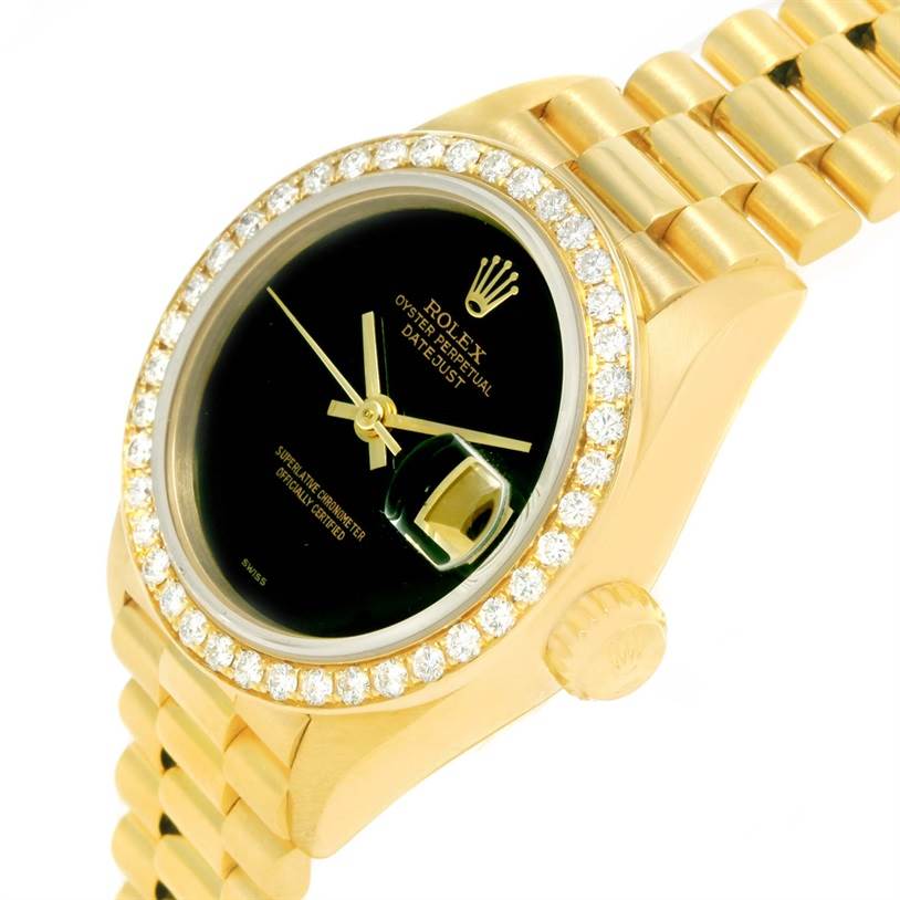 The Rolex President 69178 Women's Yellow Gold Black Dial 69178 Women's Yellow Gold Black Dial model watch is shown at an angle displaying its black dial, golden bezel with diamonds, and bracelet.