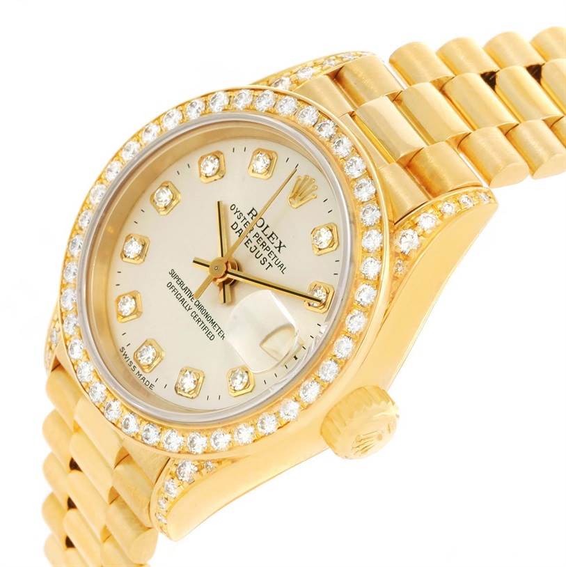 The photo shows a close-up of the face and partial gold band of the Rolex President 69158 Women's Yellow Gold Silver Dial 69158 Women's Yellow Gold Silver Dial model watch at an oblique angle.