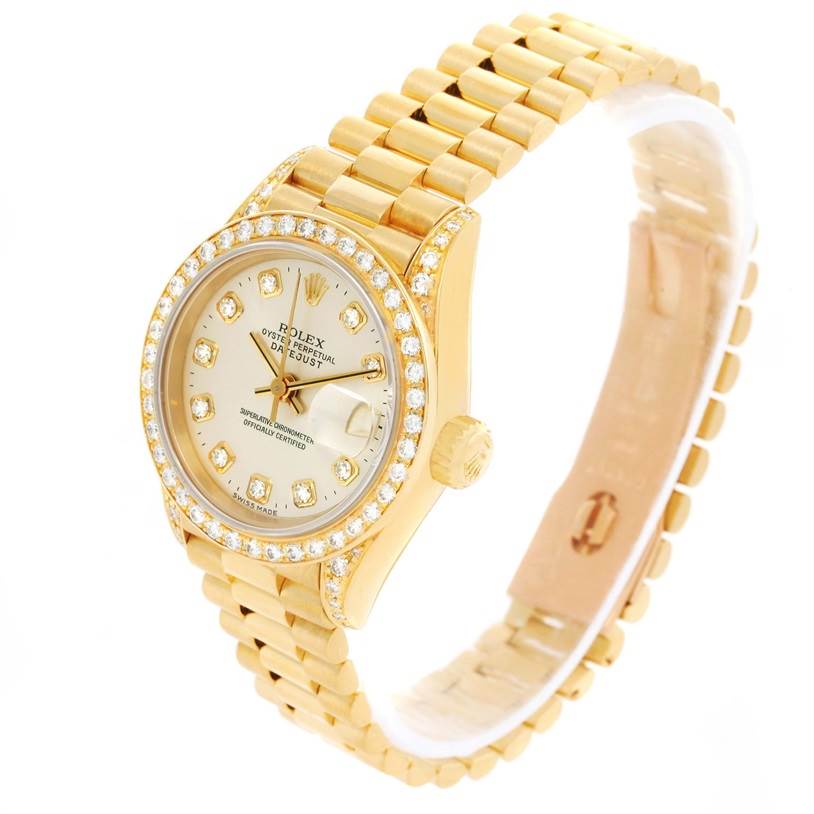 The image shows a Rolex President 69158 Women's Yellow Gold Silver Dial 69158 Women's Yellow Gold Silver Dial model watch at a slight angle, highlighting the diamond-studded bezel, dial, and gold bracelet.