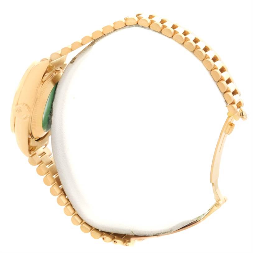 The side angle of the Rolex President 69138 Women's Yellow Gold Blue Dial 69138 Women's Yellow Gold Blue Dial model watch shows the clasp and part of the bracelet.