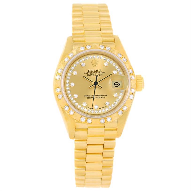 The image shows a front view of a Rolex President 69258 Women
s Champagne Dial 69258 Women
s Champagne Dial watch with a gold bracelet, diamond-encrusted bezel, and date display.