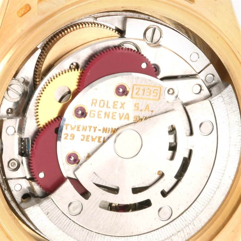 This image shows the interior mechanism of a Rolex President 69178 Women's Yellow Gold Black Dial 69178 Women's Yellow Gold Black Dial model watch, featuring gears and the 29-jewel movement.