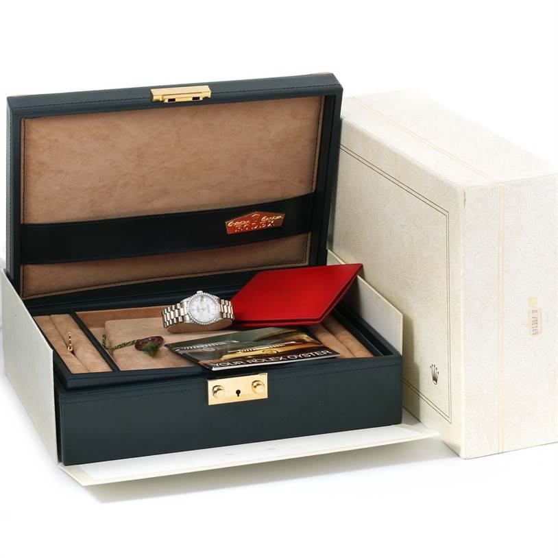 The image shows a Rolex President 68159 Women's White Gold Mother of Pearl Dial 68159 Women's White Gold Mother of Pearl Dial model watch in an open case with documentation and accessories.