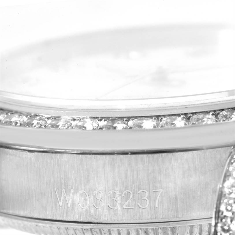 The image shows a close-up of the bezel with diamonds and part of the case, displaying the serial number of the Rolex President 68159 Women's White Gold Mother of Pearl Dial 68159 Women's White Gold Mother of Pearl Dial model watch.