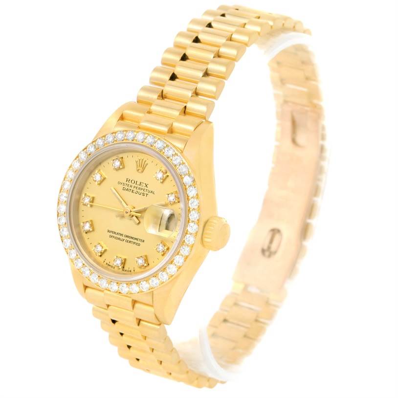The Rolex President 69178 Women's Yellow Gold Champagne Dial 69178 Women's Yellow Gold Champagne Dial model watch is shown at an angled view, highlighting the gold bracelet, diamond bezel, crown, and face.