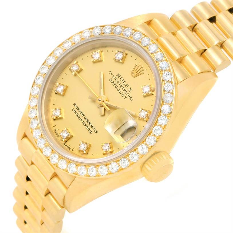 The image shows a Rolex President 69178 Women's Yellow Gold Champagne Dial 69178 Women's Yellow Gold Champagne Dial model watch, highlighting its diamond-encrusted bezel, dial, and bracelet from an angled side view.