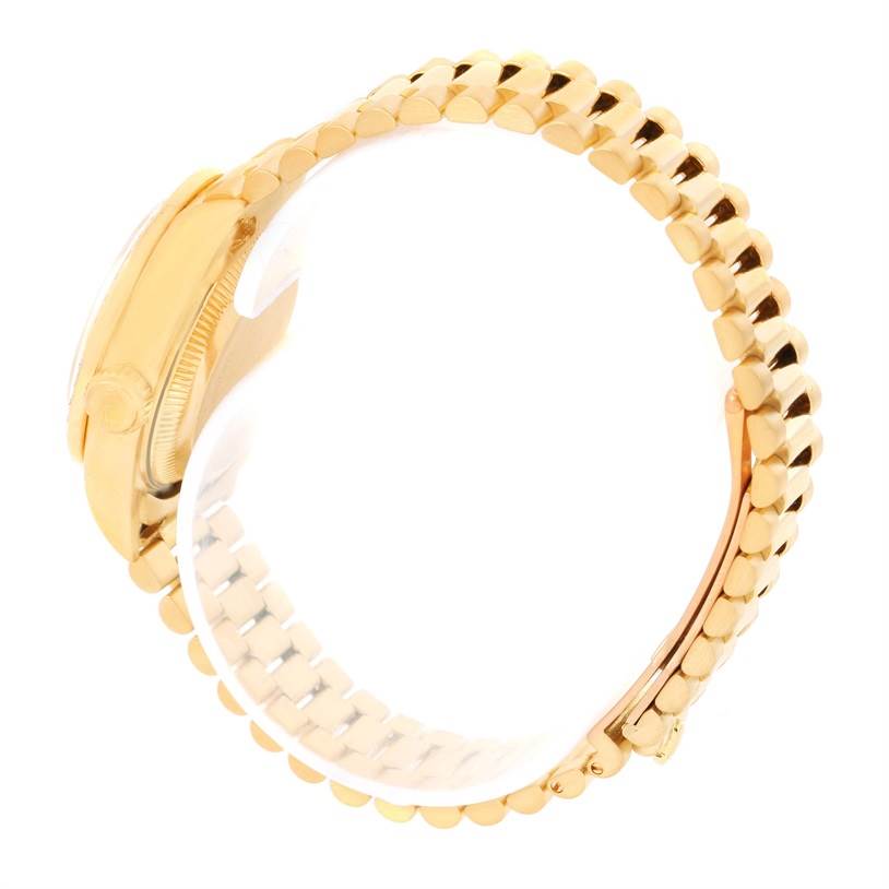 The image shows a side view of a Rolex President 69178 Women's Yellow Gold Champagne Dial 69178 Women's Yellow Gold Champagne Dial model watch, highlighting its gold case, crown, and bracelet.