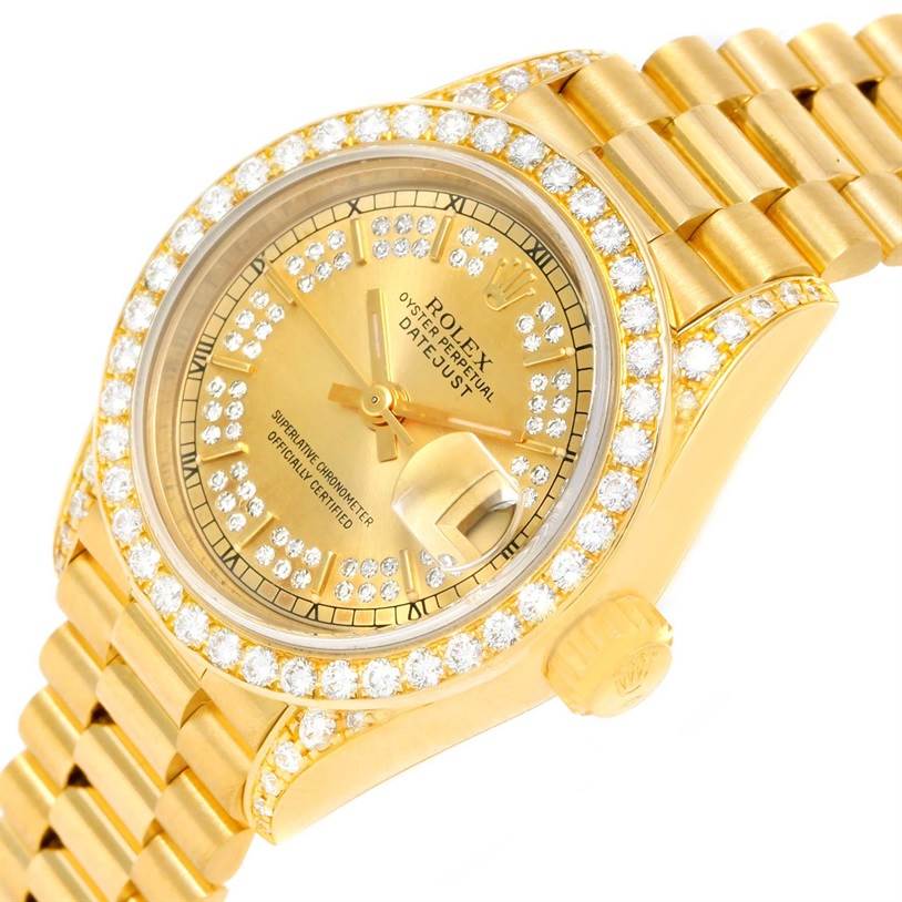 The image shows a Rolex President 69188 Women's Yellow Gold Champagne Dial 69188 Women's Yellow Gold Champagne Dial watch angled from the top-right, highlighting the gold face, diamond bezel, and part of the bracelet.
