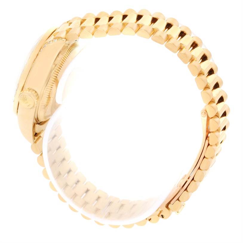 The image shows a side view of the Rolex President 69188 Women's Yellow Gold Champagne Dial 69188 Women's Yellow Gold Champagne Dial model's gold bracelet and part of the case.