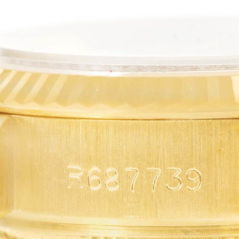 This image shows a close-up of the side case with the engraved serial number on a Rolex President 69178 Women
s Yellow Gold Champagne Dial 69178 Women
s Yellow Gold Champagne Dial model watch.