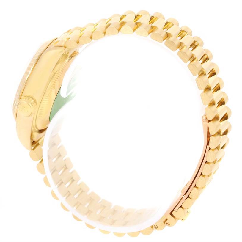 The image shows a side view of a Rolex President 69178 Women
s Yellow Gold Champagne Dial 69178 Women
s Yellow Gold Champagne Dial model watch, highlighting the gold case and the bracelet with its clasp.