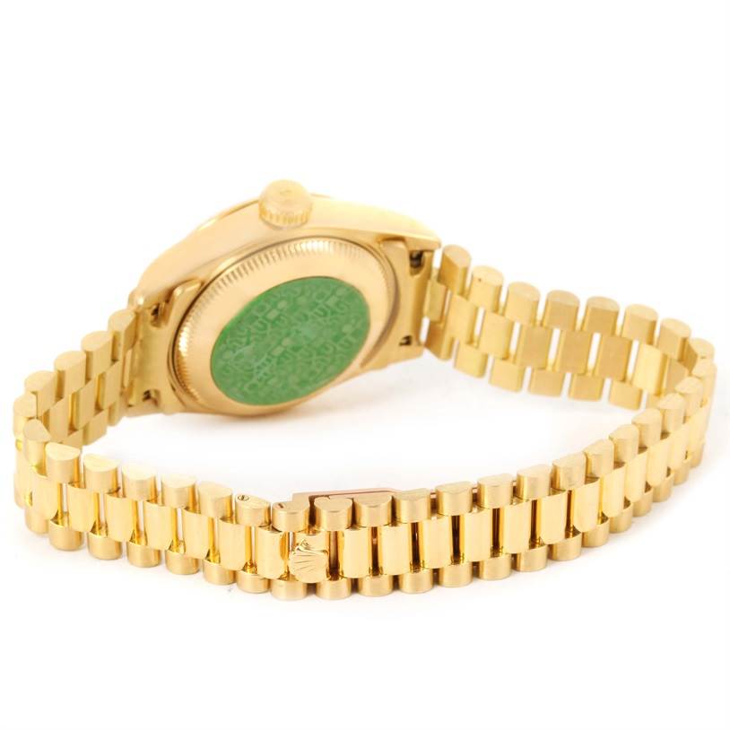This image shows the back case, crown, and bracelet of a Rolex President 69178 Women
s Yellow Gold Champagne Dial 69178 Women
s Yellow Gold Champagne Dial model watch from an angled rear view.