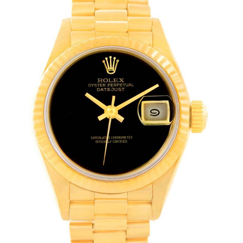 The image shows a top view of a Rolex President 69178 Women's Yellow Gold Black Dial 69178 Women's Yellow Gold Black Dial model watch, displaying the face, bezel, crown, and part of the bracelet.