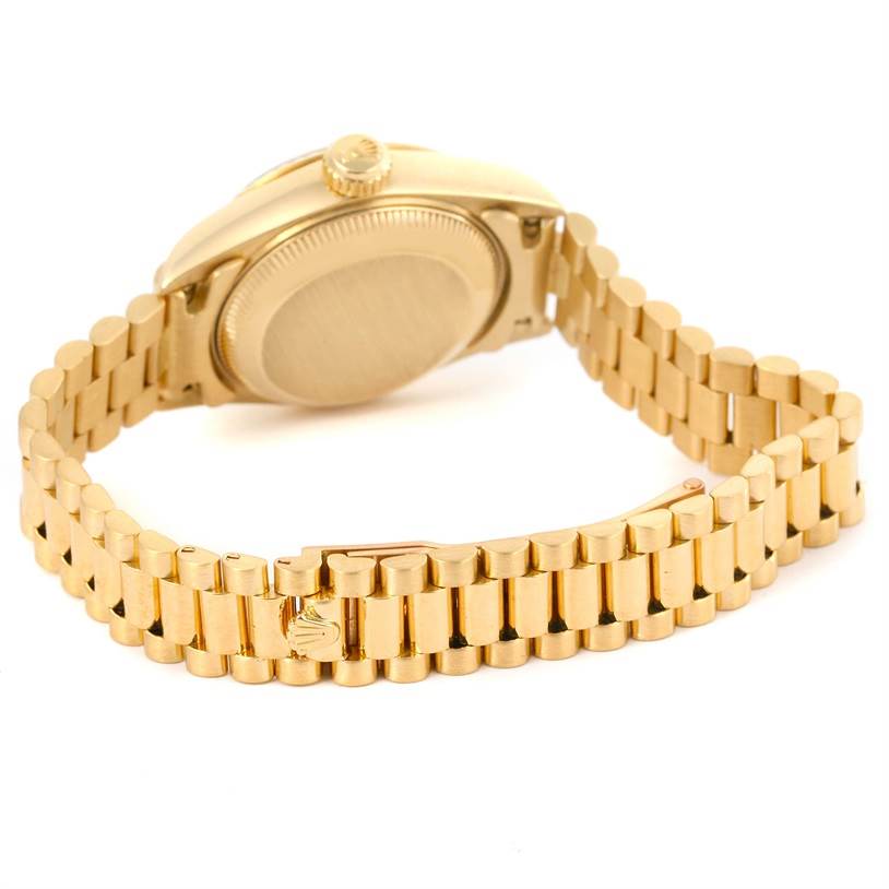 This image shows the back and side of the Rolex President 69178 Women
s Yellow Gold Champagne Dial 69178 Women
s Yellow Gold Champagne Dial model watch, including the bracelet and crown.