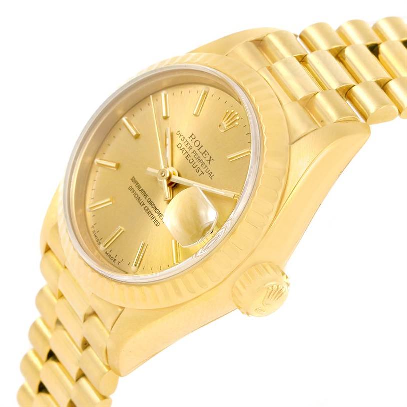 The image shows a close-up side angle of a Rolex President 69178 Women
s Yellow Gold Champagne Dial 69178 Women
s Yellow Gold Champagne Dial model, highlighting the gold dial, crown, and part of the bracelet.
