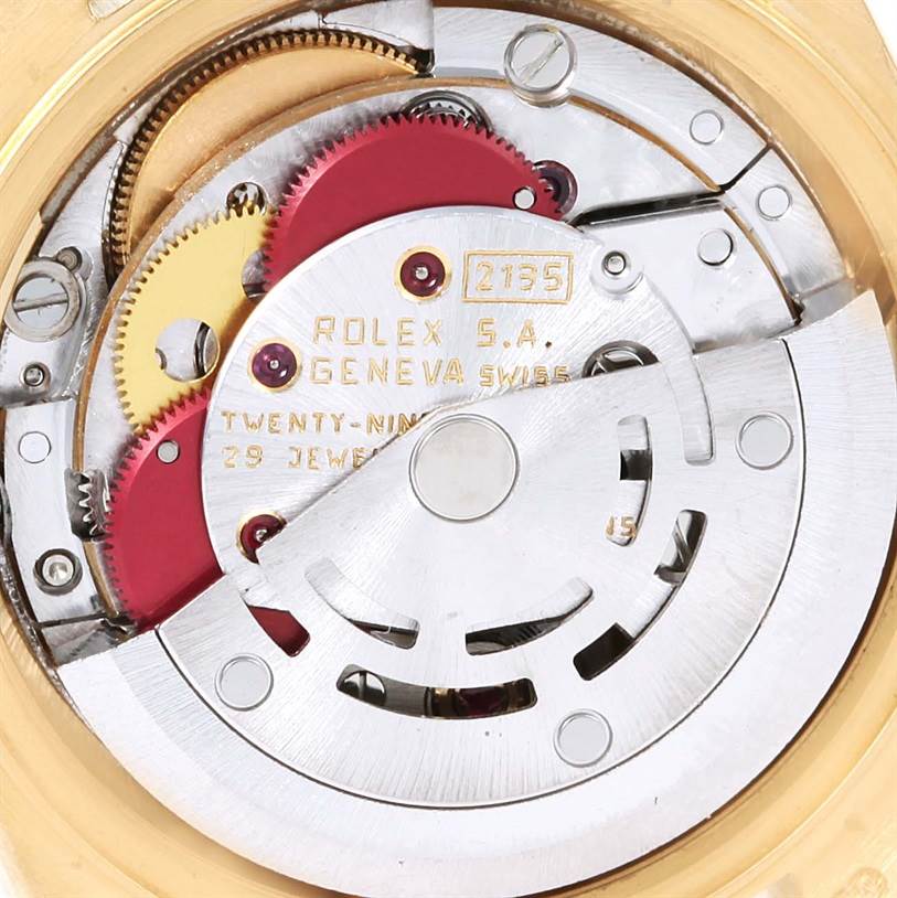 This image shows the internal movement mechanism of a Rolex President 69178 Women's Yellow Gold Champagne Dial 69178 Women's Yellow Gold Champagne Dial model watch, highlighting its gears and components.