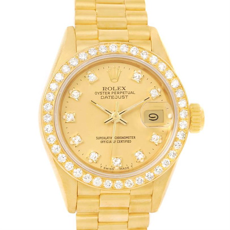 This image shows a front view of a Rolex President Datejust watch, highlighting its gold case, diamond-studded bezel, and bracelet.