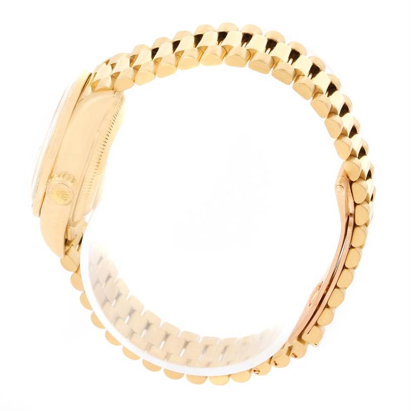 The image shows a side view of a Rolex President 69178 Women's Yellow Gold Champagne Dial 69178 Women's Yellow Gold Champagne Dial model watch, focusing on the gold bracelet and case.