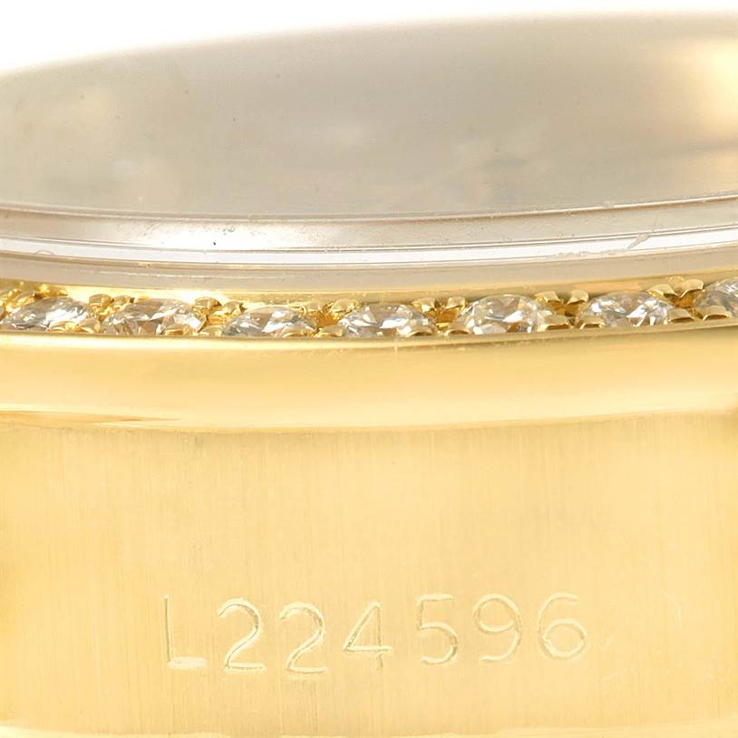 The image shows a close-up angle of the side of a Rolex President 69178 Women's Yellow Gold Champagne Dial 69178 Women's Yellow Gold Champagne Dial model watch, highlighting part of the gold case and serial number L224596.
