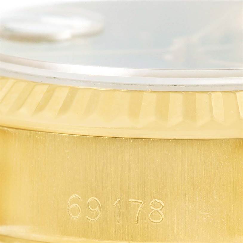 This image shows a close-up of the Rolex President 69178 Women's Yellow Gold Blue Dial 69178 Women's Yellow Gold Blue Dial model's case side, highlighting its model number 69178 and fluted bezel.