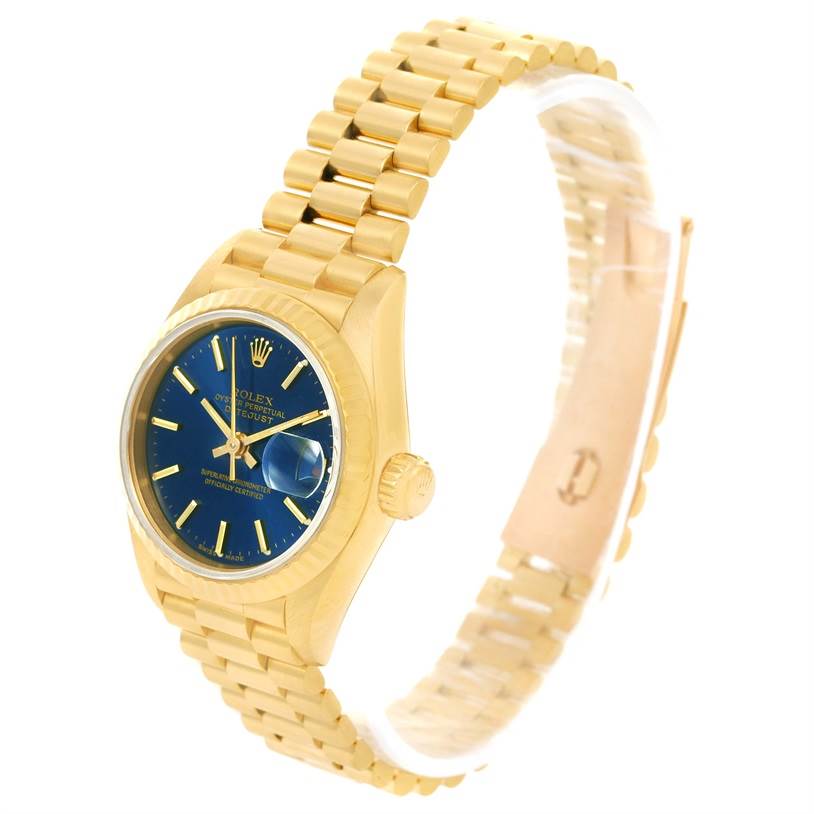 The image shows a Rolex President 69178 Women's Yellow Gold Blue Dial 69178 Women's Yellow Gold Blue Dial watch from an angled front view, highlighting the gold bracelet, crown, and blue dial with date magnifier.