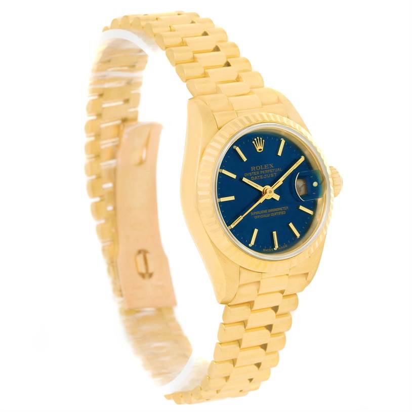 The image shows a Rolex President 69178 Women's Yellow Gold Blue Dial 69178 Women's Yellow Gold Blue Dial model watch angled at a three-quarter view, highlighting its yellow gold band and blue dial.