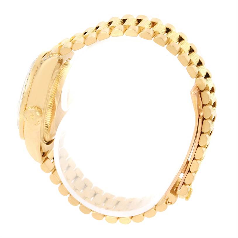 The image shows a side view of the Rolex President 69158 Women's Yellow Gold Mother of Pearl Dial 69158 Women's Yellow Gold Mother of Pearl Dial model, highlighting the case and the bracelet with its characteristic links.