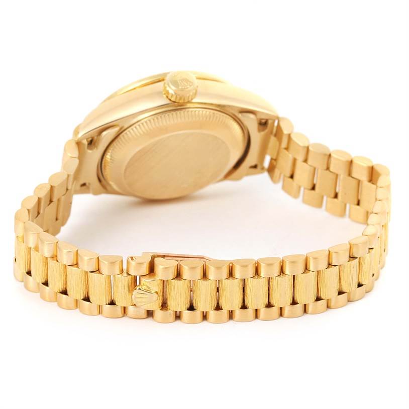 This image shows the backside and bracelet of a Rolex President 69158 Women's Yellow Gold Mother of Pearl Dial 69158 Women's Yellow Gold Mother of Pearl Dial model watch in gold.