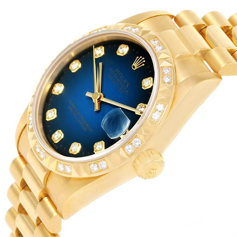 The President model by Rolex is shown at a slight angled side view, displaying its gold bracelet, blue dial, and diamond-set bezel.