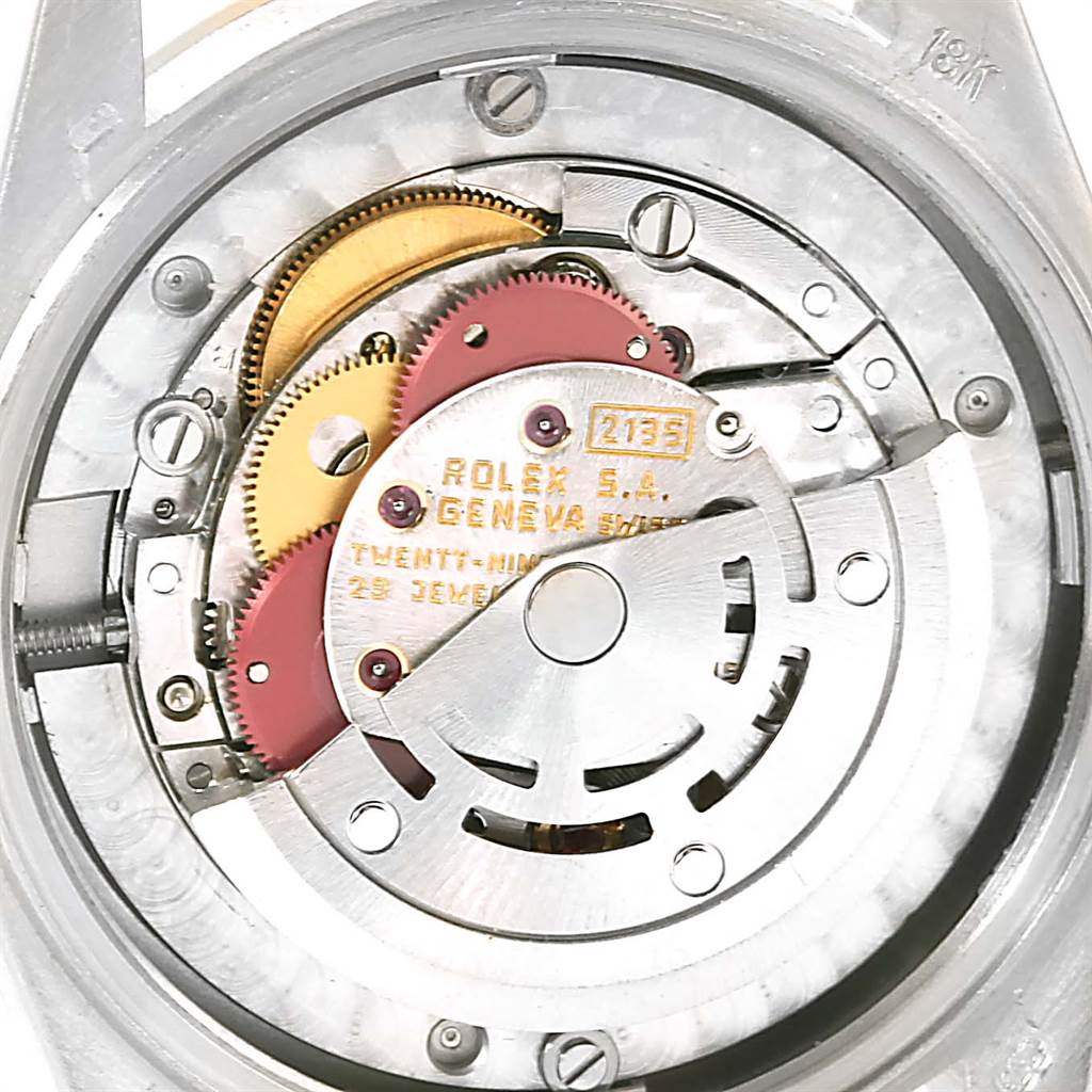 The image shows the internal mechanism of a Rolex President 68279B Women's White Gold Brown Dial 68279B Women's White Gold Brown Dial model watch, highlighting gears and components of the movement.