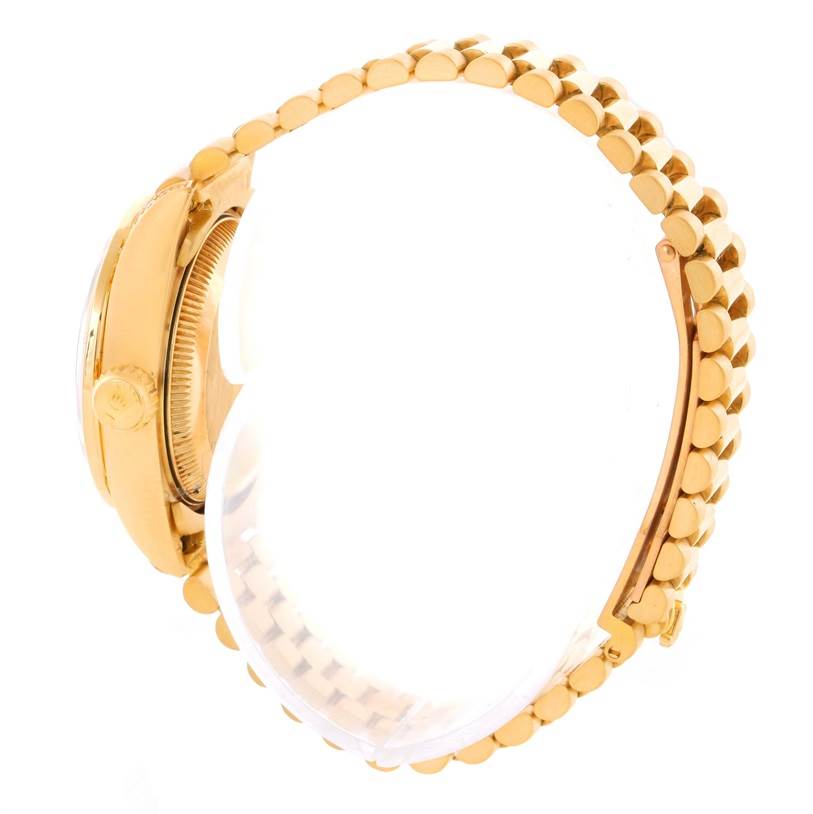 The image shows a side view of a Rolex President 69158 Women's Yellow Gold Mother of Pearl Dial 69158 Women's Yellow Gold Mother of Pearl Dial model watch highlighting its gold bracelet and crown.