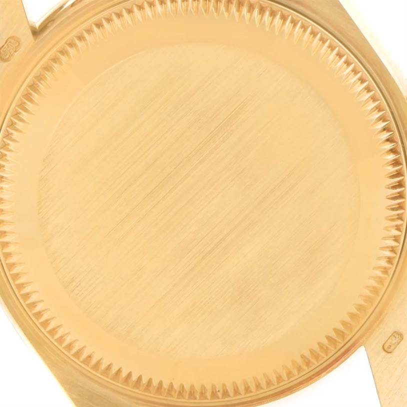 This image shows the close-up of the case back of a Rolex President 69158 Women's Yellow Gold Mother of Pearl Dial 69158 Women's Yellow Gold Mother of Pearl Dial model watch.