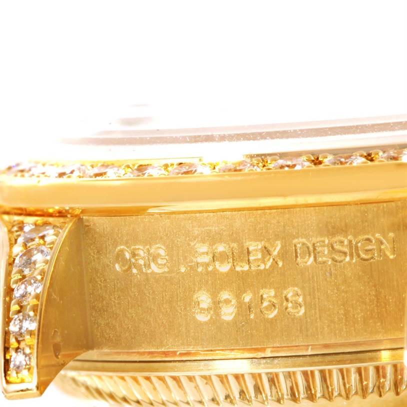 The close-up image shows a side view of the bezel and case of a Rolex President 69158 Women's Yellow Gold Mother of Pearl Dial 69158 Women's Yellow Gold Mother of Pearl Dial model, engraved with "ORG. ROLEX DESIGN" and the number 69158.