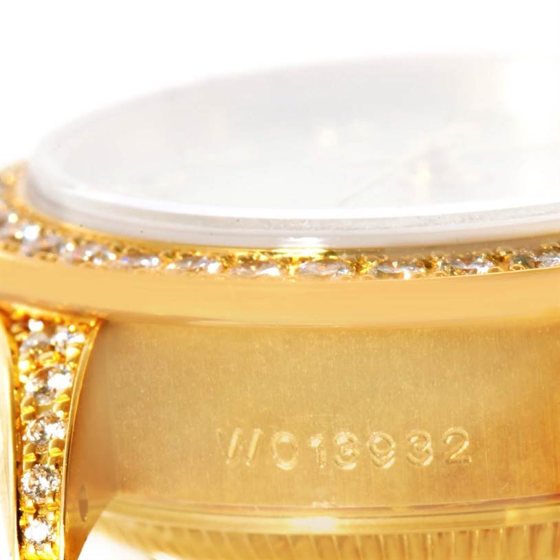 This close-up image shows the side and bezel of a Rolex President 69158 Women's Yellow Gold Mother of Pearl Dial 69158 Women's Yellow Gold Mother of Pearl Dial model watch, highlighting the serial number and diamond accents.
