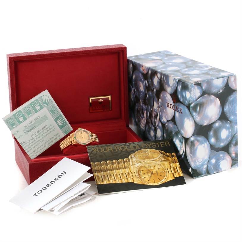 The image shows a Rolex President 69078 Women's Yellow Gold Champagne Dial 69078 Women's Yellow Gold Champagne Dial model watch with its packaging, warranty card, and manuals.