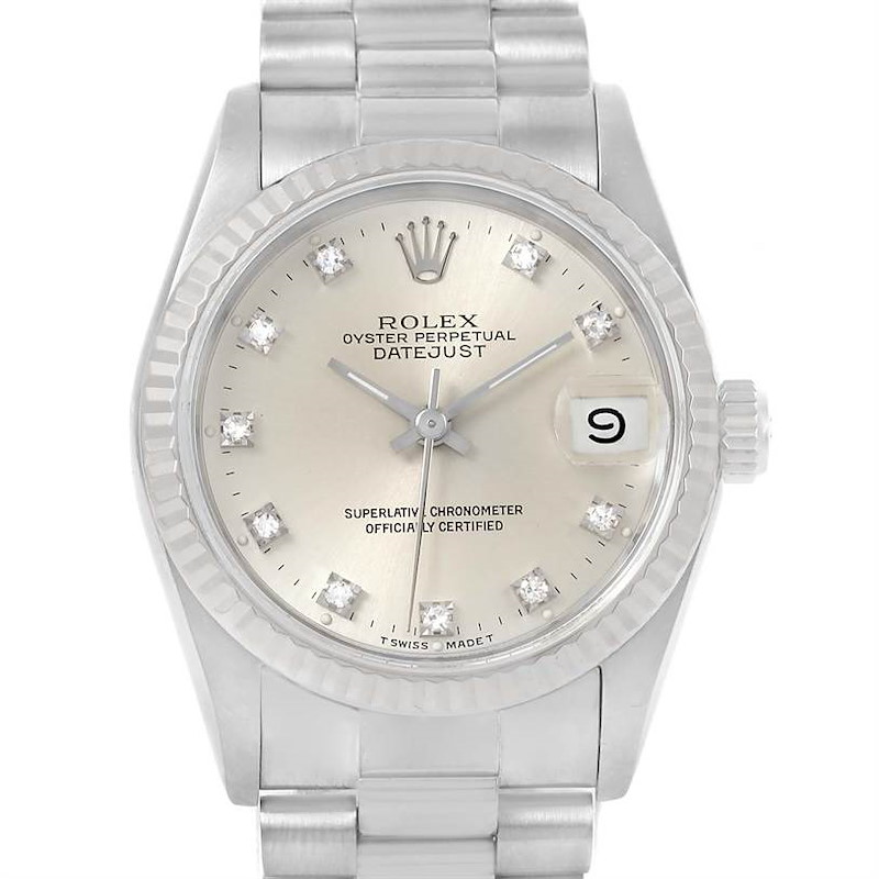 This image shows a frontal view of a Rolex President model watch, highlighting its dial, bezel, bracelet, and date display.