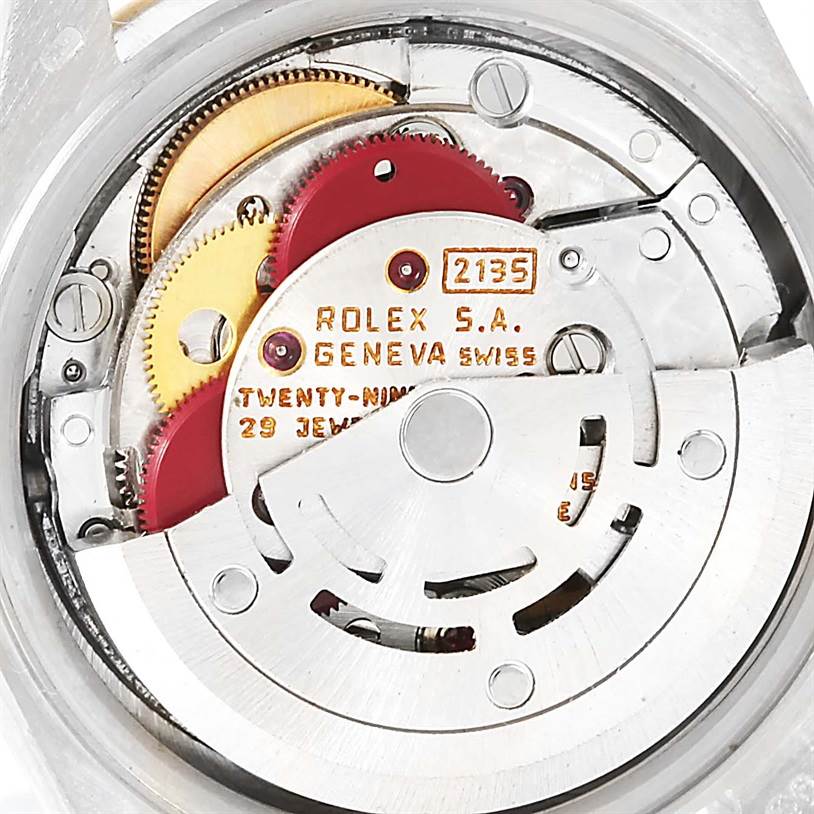 The image shows the internal movement mechanism of a Rolex President 69179 Women's White Gold Brown Dial 69179 Women's White Gold Brown Dial model watch, highlighting gears and the automatic winding rotor.