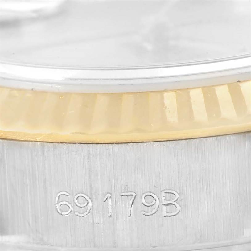This close-up angle of the Rolex President 69179 Women's White Gold Brown Dial 69179 Women's White Gold Brown Dial model focuses on the watch's case side, bezel, and model number engraving.